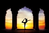 21089986-man-silhouette-doing-yoga-in-old-temple-at-orange-sunset-sky-background